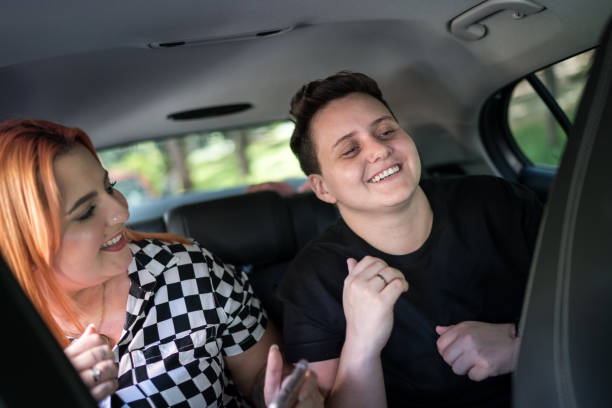 istock Friends dancing and having fun inside the car 1213277531
