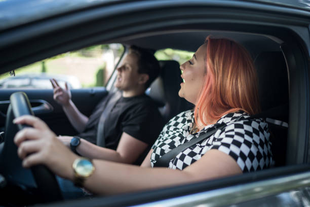 istock Friends dancing and having fun inside the car 1213277577