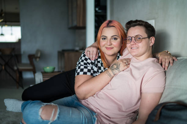 Portrait of lesbian couple at home Portrait of lesbian couple at home gender neutral photos stock pictures, royalty-free photos & images