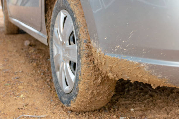 istock a close up view of mud sprayed all around a car tyre 1213278122