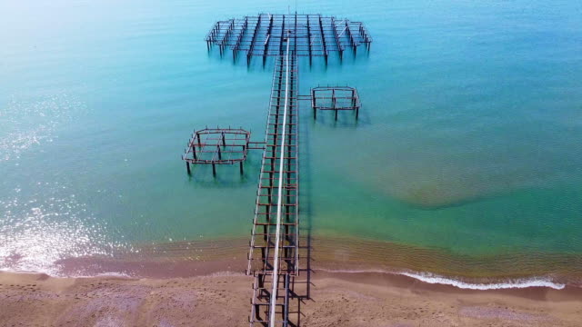 aerial shot coast and pier with drone
