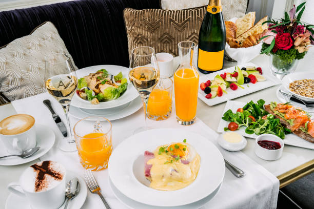 istock Brunch with poached eggs, fruit, orange juice and cava 1213280272