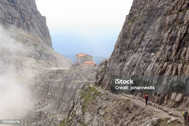 Alpine Hut Rifugio Pedrotti And Mountain Alps Panorama In Brenta Dolomites Italy Stock Photo - Download Image Now