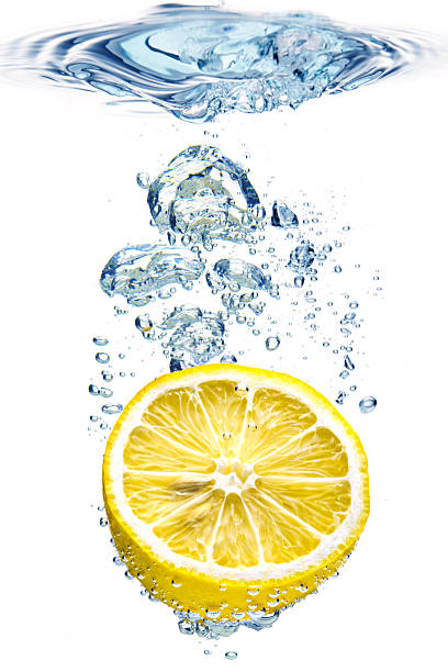 istock Large bubbles in blue water with an orange at the bottom 121328909
