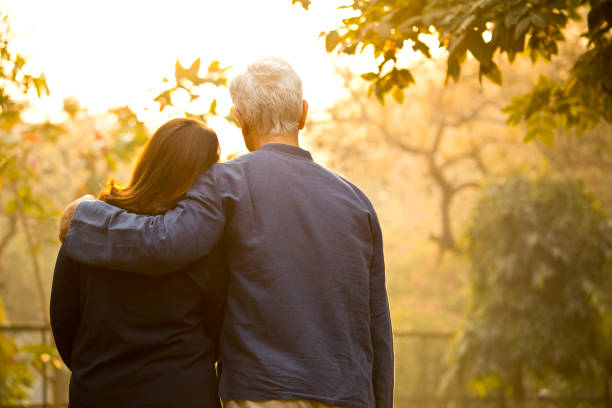 istock Couple relaxing at park 1213291937