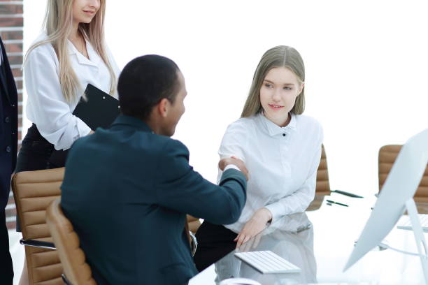 istock handshake Manager and the client in the office 1213293471