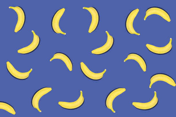 istock Colorful fruit pattern of fresh yellow bananas on blue background. 1213296152