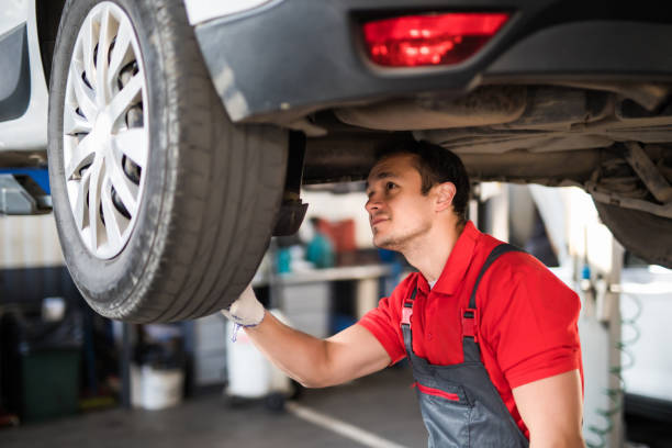 istock Handsome man mechanic with tool checking the car 1213296622