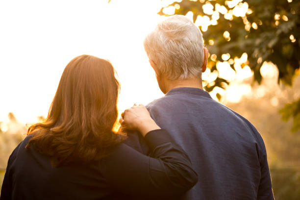 istock Couple relaxing at park 1213296923