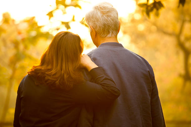 istock Couple relaxing at park 1213297042