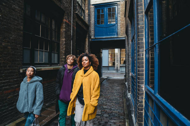 istock Three hip friends walking together in the city 1213297864