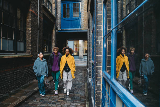 istock Three hip friends walking together in the city 1213297870