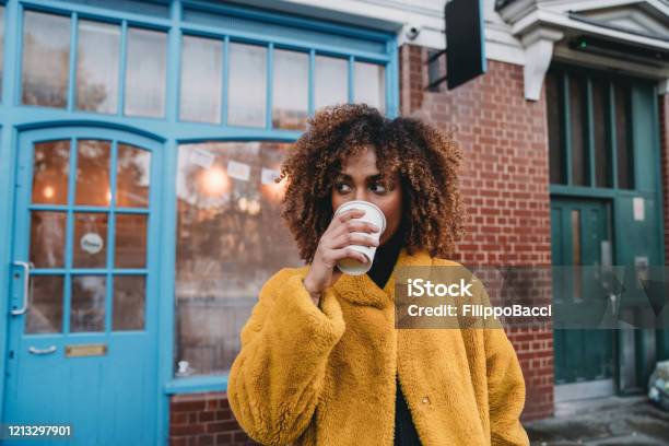 Portrait Of A Young Adult Beautiful Woman Drinking Coffee Stock Photo - Download Image Now