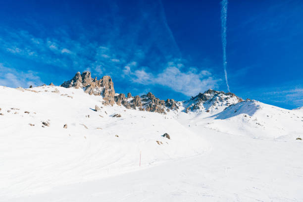Pair of back country ski on the top with scenic view of the italian western Alps in winter. The majestic Monte Viso (3841 m) in the background. Black and white.