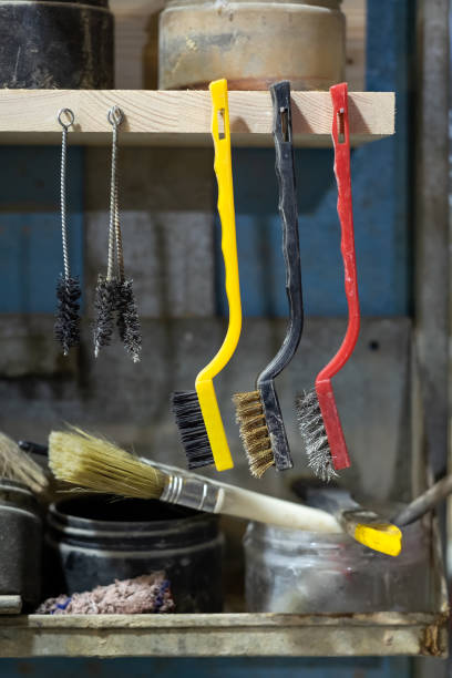 istock Several metal cord brush in workspace of carpenter. 1213300471
