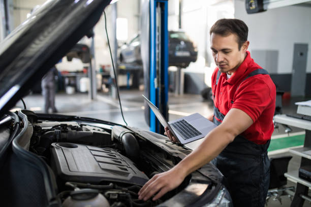 istock Professional man car mechanic working in auto repair service. 1213302564