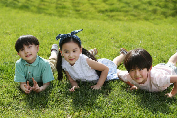 istock Children are playing on the grass 1213302716