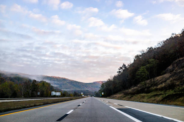 fog mist covering forest trees and pastel sunrise in rural countryside in west virginia near new river gorge in morning autumn - rapid appalachian mountains autumn water imagens e fotografias de stock