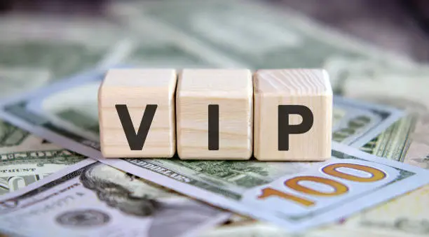 Photo of VIP - Business concept on cubes and dollars