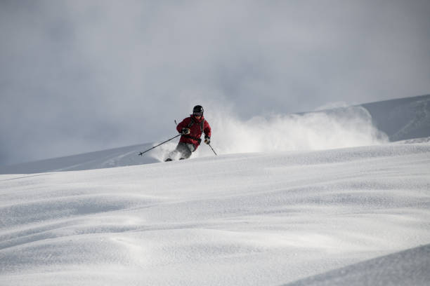 istock Male on a ski gliding on a snowy mountain 1213309038