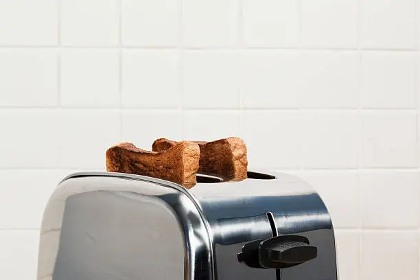 Photo of Two slices of toast in toaster