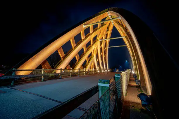 Sneek, Netherlands, September 2020. Perpendicular view of a bridge with a span made of curved wooden beams, without traffic