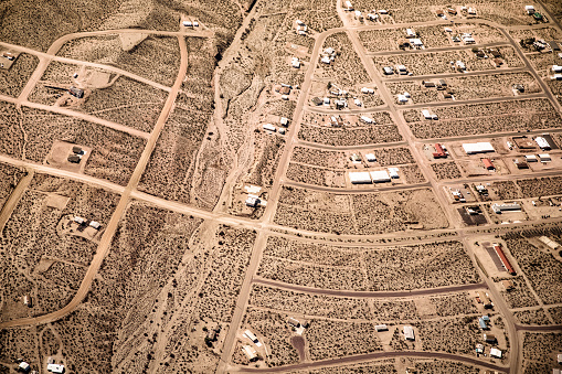 Aerial photography over Nevada Mojave desert with roads and town