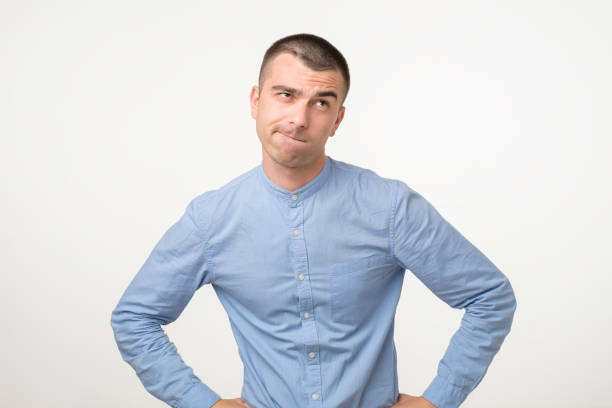 istock Thoughtful hispanic young man trying to find a right solution generating idea 1213309729