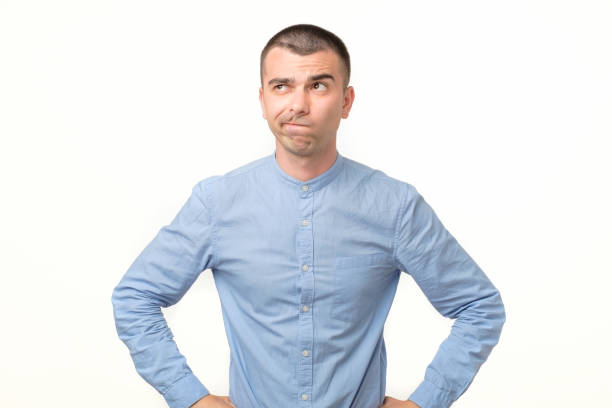 istock Thoughtful hispanic young man trying to find a right solution generating idea 1213309752