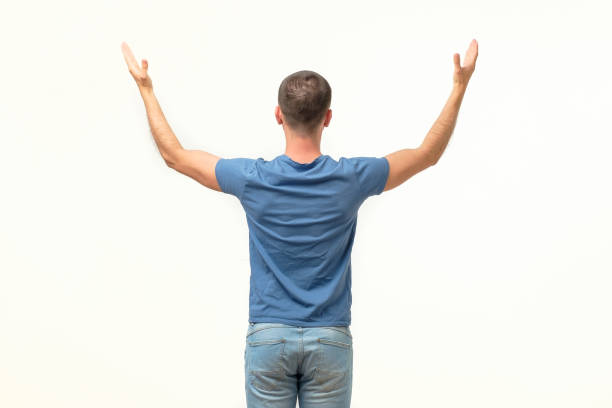istock Casual man welcoming someone, isolated on white background. Rear view 1213309916