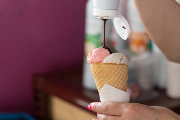 istock colorful fruit ice cream cone in hands close up 1213311238