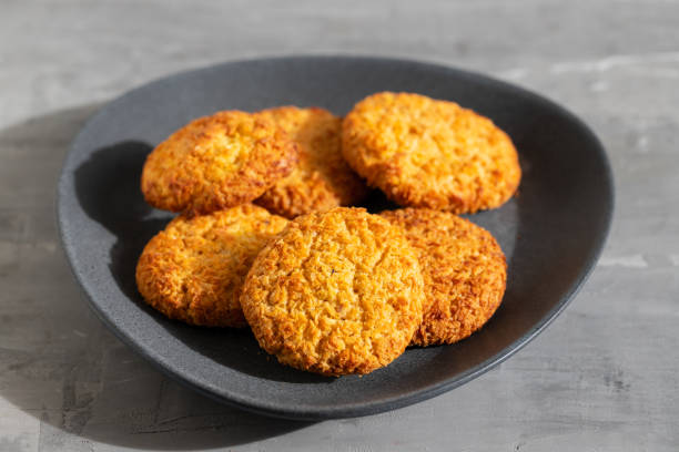 istock coconut cookies on dark dish on ceramic background 1213315571