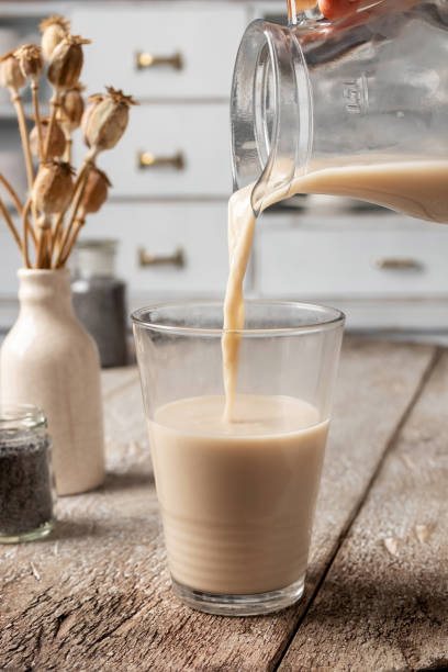 istock Pouring poppy seed milk into a glass 1213316214