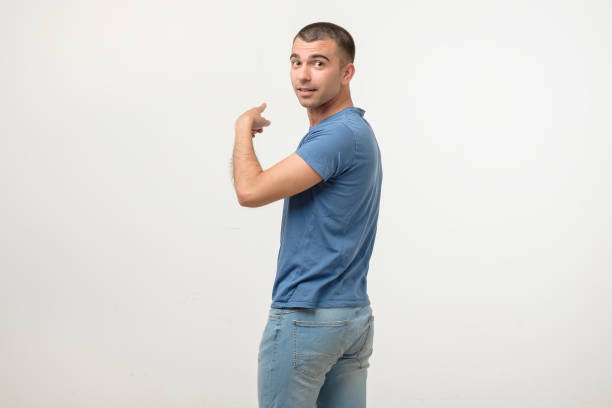 istock Young hispanic man pointing on copyspace trying to pay attention. 1213316714