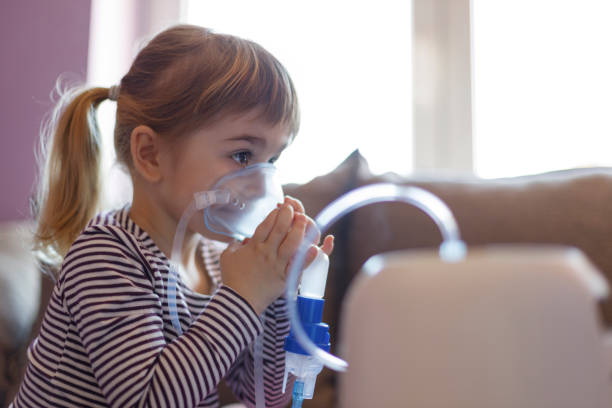 istock Sad sick kid on inhalation 1213316864