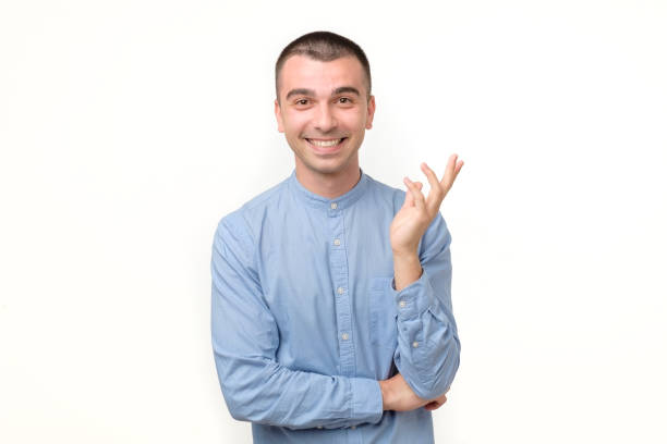 istock Happy smiling hispanic guy looking at camera isolated on white background 1213316901