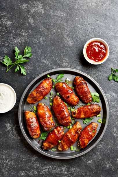 istock Bacon wrapped grilled chicken wings 1213318541