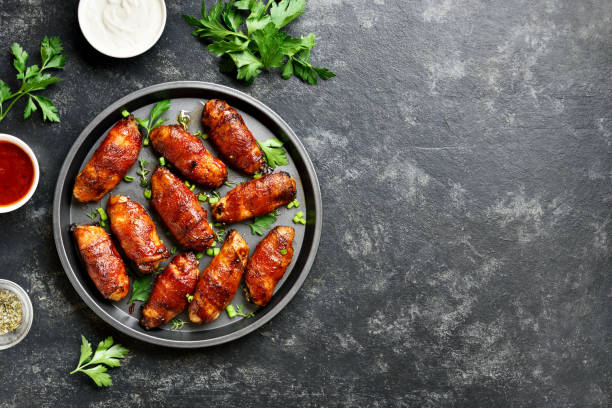 istock Bacon wrapped grilled chicken wings 1213318586