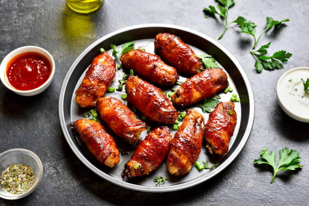 istock Bacon wrapped grilled chicken wings 1213318600
