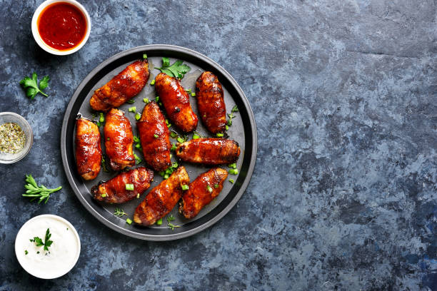 istock Bacon wrapped grilled chicken wings 1213318644