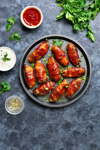 istock Bacon wrapped grilled chicken wings 1213318771