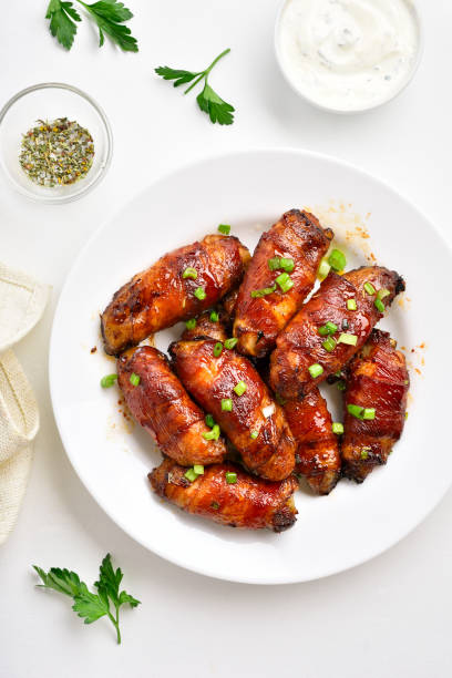 istock Bacon wrapped grilled chicken wings 1213318788