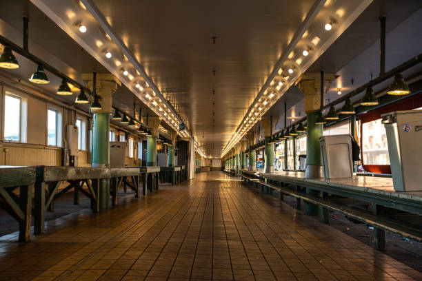 A usually exceptionally crowded and lively marketplace, Pike Place in Seattle is a ghost of its former self, shuttered and empty.