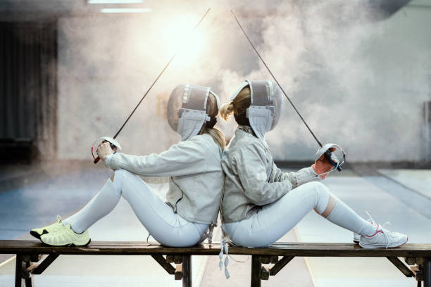two female fencer's - fencing sport rivalry sword imagens e fotografias de stock