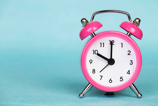istock Deadline, time concept, alarm clock on blue background 1213321992