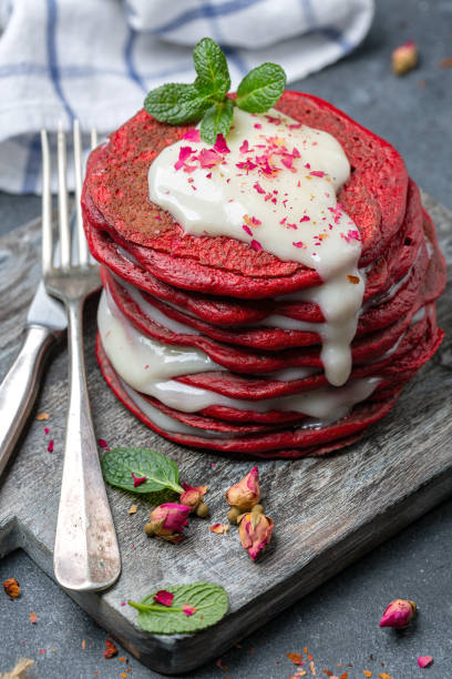 istock Red velvet pancakes served with cream cheese sauce. 1213327111