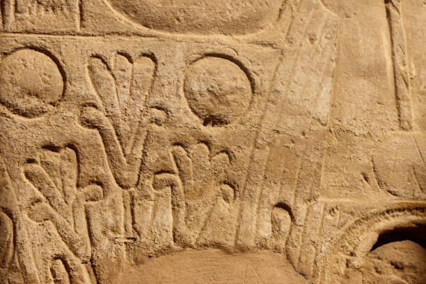 istock Ancient egyptian hieroglyphs on the wall in Karnak Temple Complex in Luxor, Egypt 1213327383