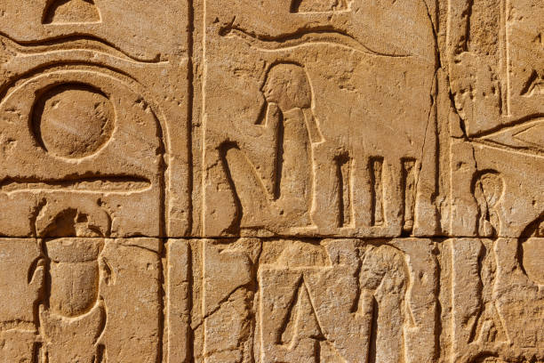 istock Ancient egyptian hieroglyphs on the wall in Karnak Temple Complex in Luxor, Egypt 1213327391