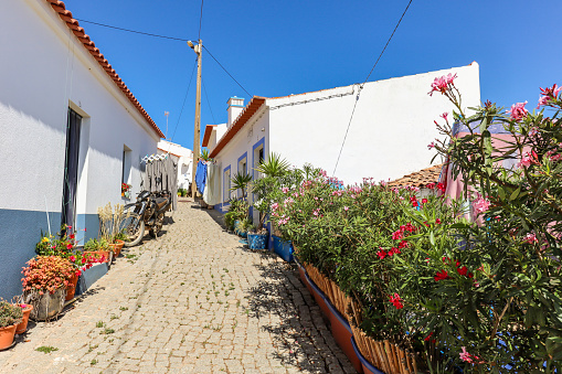 Village street with residential buildings in the town Carrapateira, in the municipality of Aljezur in the District of Faro, Algarve Portugal