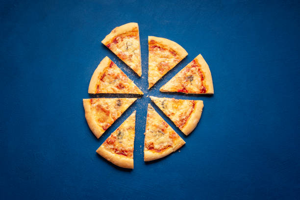 istock Sliced pizza on blue background. 4 cheese pizza slices 1213335142